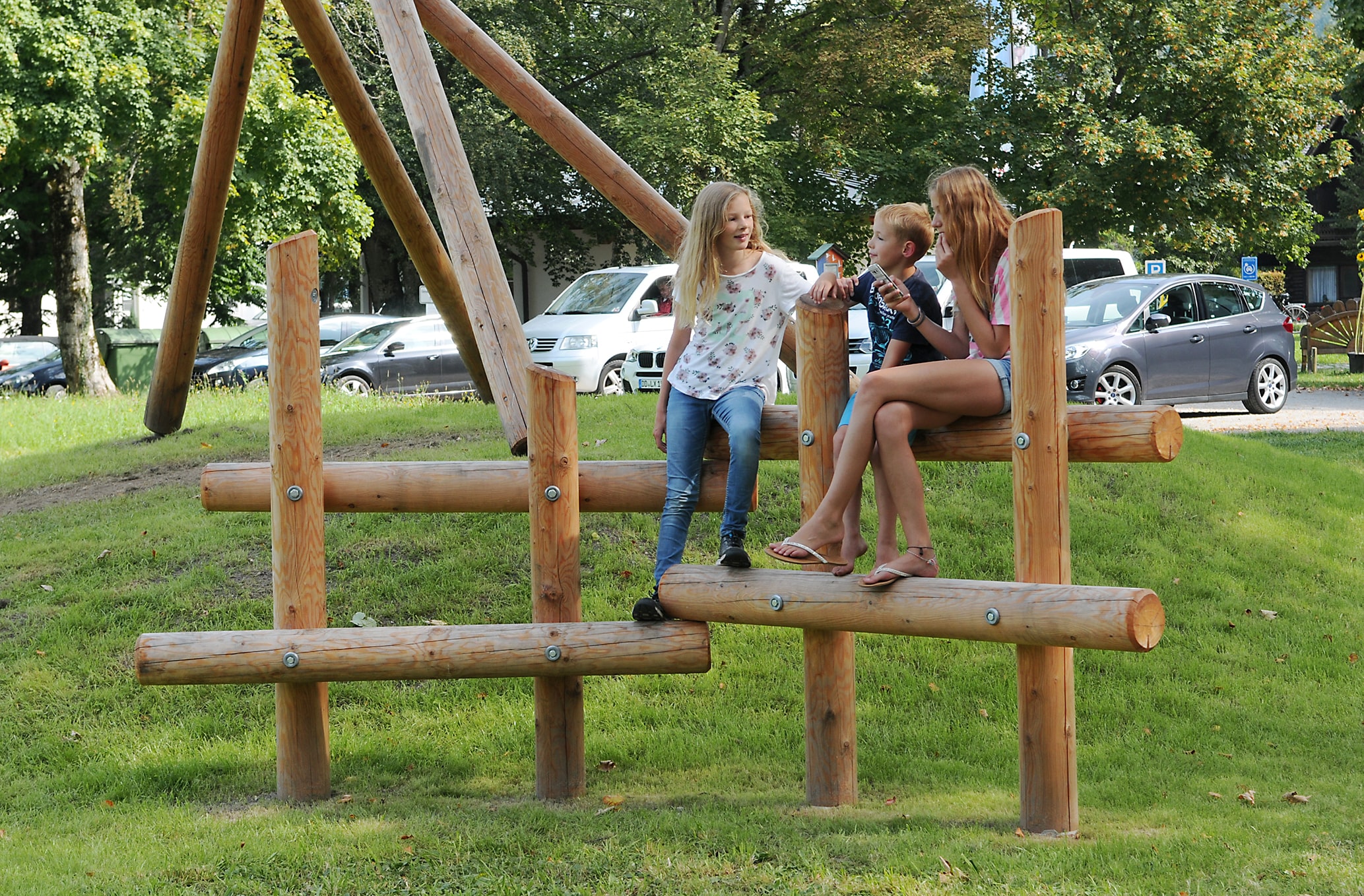 The Sitting Fence is a great seating equipment for play spaces made of timber