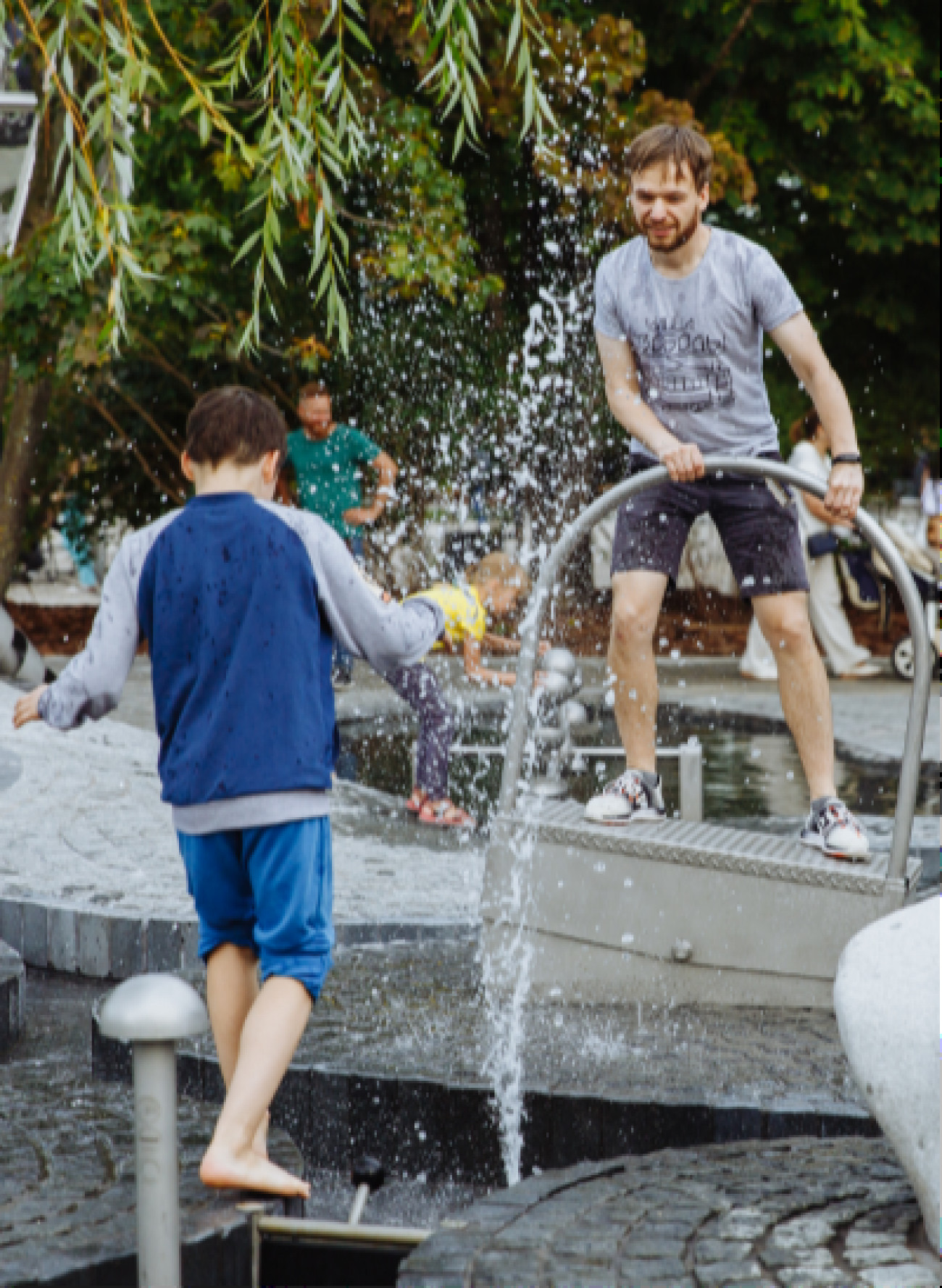 People playing with water in playground